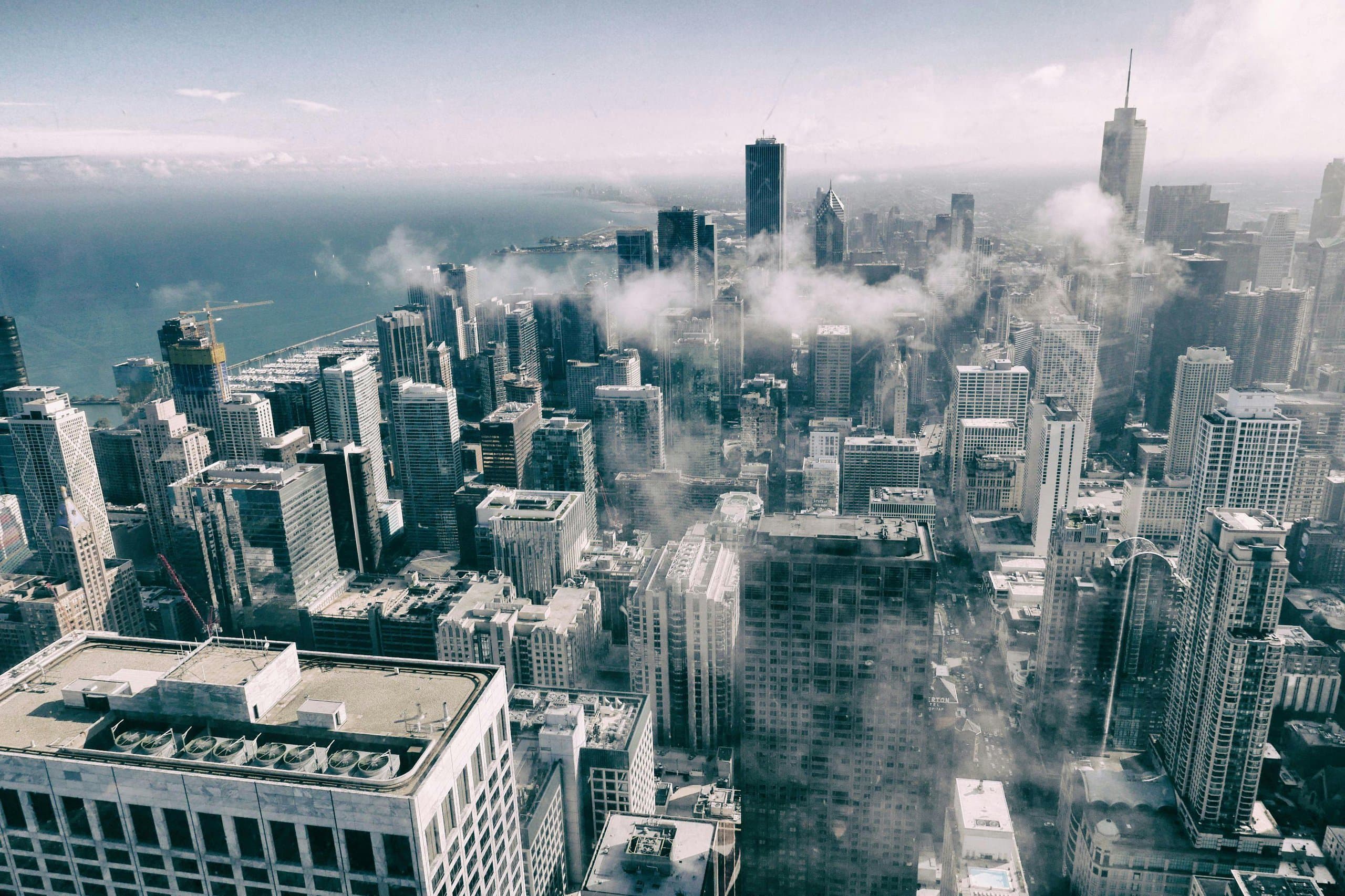 City skyline with skyscrapers and clouds